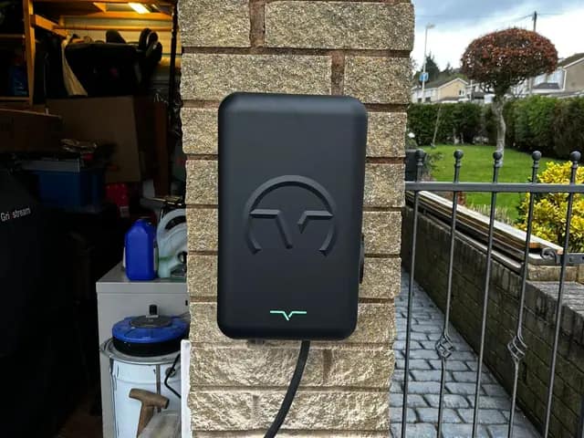 Home charger on a brick gate pillar next to the drive