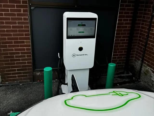 Rapid charger protected by green bollards